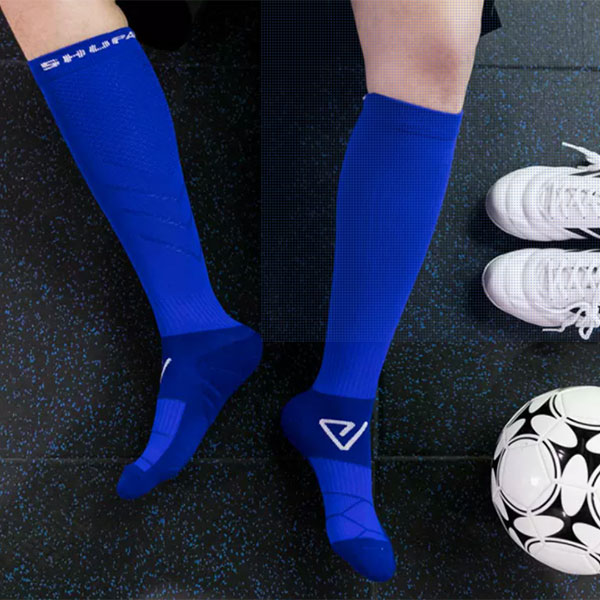 From decoration to function: the historical evolution of soccer sock length and its impact on player performance